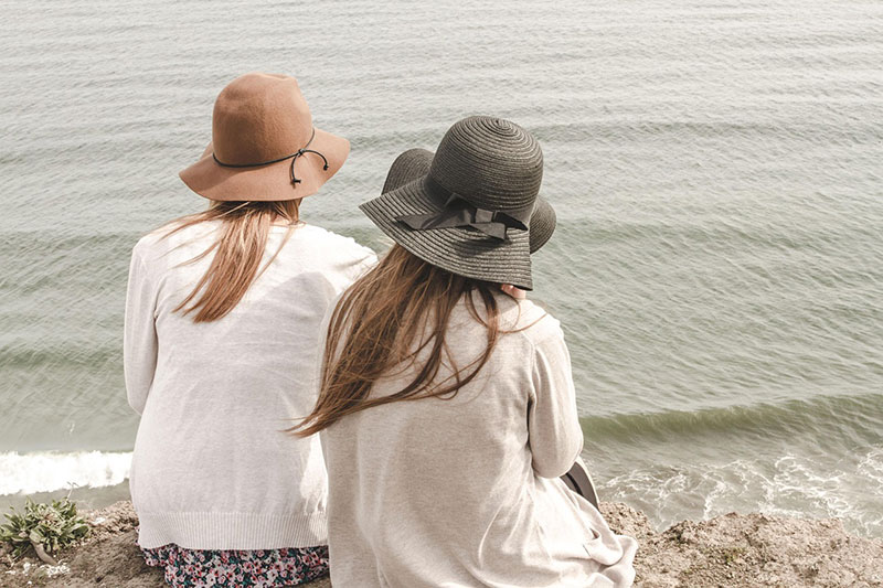 Women Sitting on the Beach